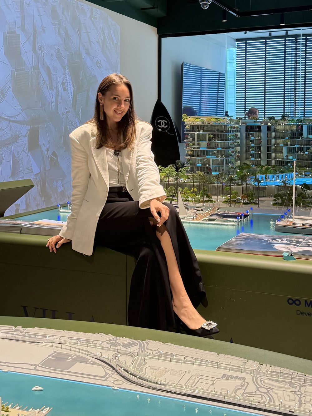 Katie Valley at a Mr. EIGHT Development project stand in Dubai